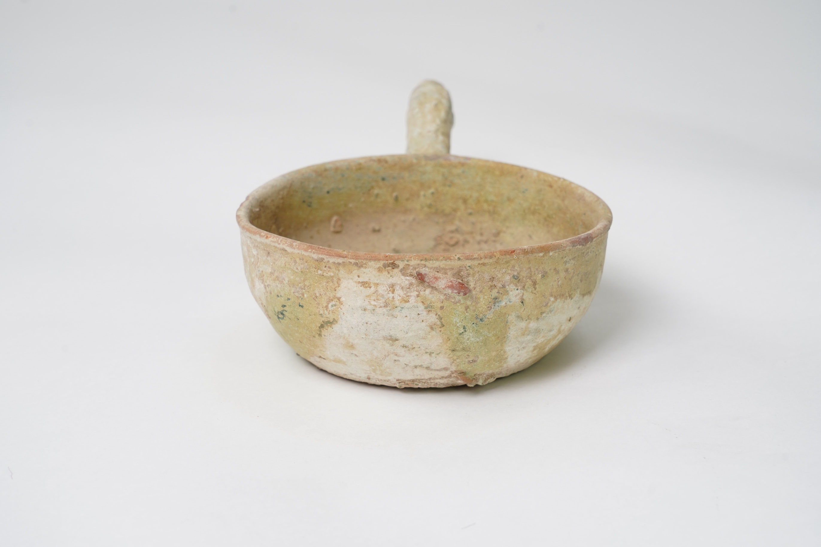 A Chinese earthenware scoop and a similar ladle, Han Dynasty (1st-2nd century A.D.)